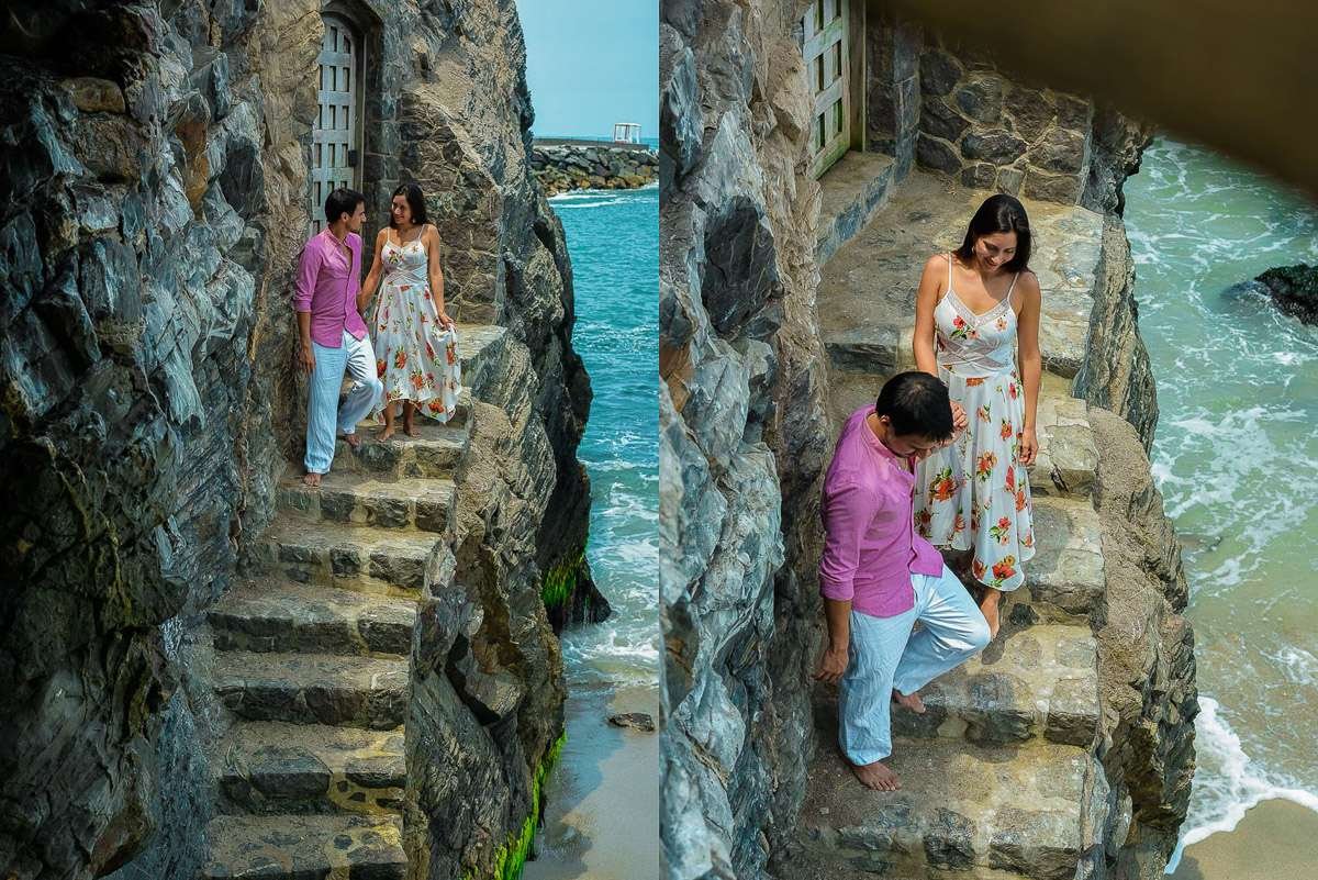 Pareja subiendo unas escaleras de piedra junto al mar