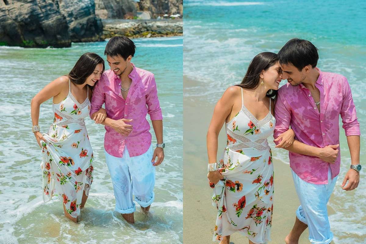 Pareja caminando por la orilla cogidos de la cintura